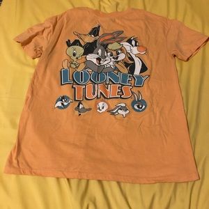 Light orange Looney Tunes t-shirt featuring Bugs Bunny, Lola, Sylvester, Tweety